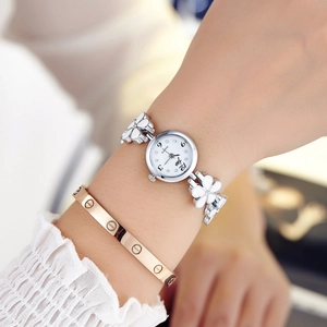 Elegant silver quartz watch for women with floral link bracelet and white round dial