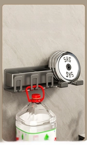Wall-mounted gunmetal bathroom rack showing strong load-bearing capacity for bottles