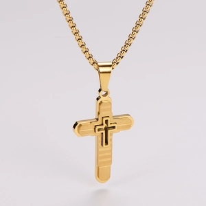 Close-up of gold layered cross pendant with textured finish on a high-quality box chain