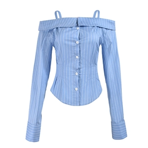 Detail of blue striped off-shoulder blouse with spaghetti straps and white button closure