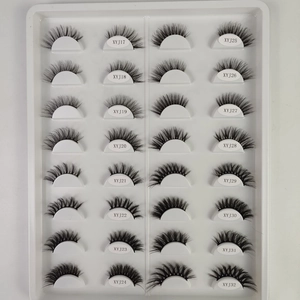 Macro display of 16 pairs cat-eye false eyelashes in white plastic storage tray