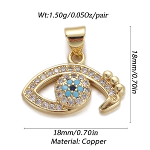 Macro view of gold-plated copper Evil Eye charm with turquoise stones and dimensions
