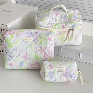 Quilted cotton makeup bag set featuring purple butterfly and floral patterns on white