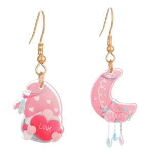 Detail of pink acrylic heart bear and moon earrings set with sparkling glitter