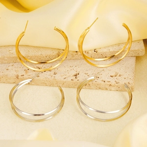 Detailed macro view of 304 stainless steel double hoop earrings in gold and silver