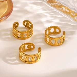 Three-piece gold adjustable ring set featuring shell, bow, and hollow heart designs