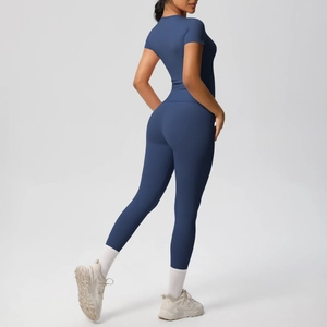 Detailed side view of high-waist yoga pants and skin-friendly athletic short sleeve set