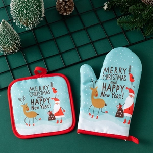 Detailed view of Christmas oven mitt and pot holder set with Santa and reindeer patterns