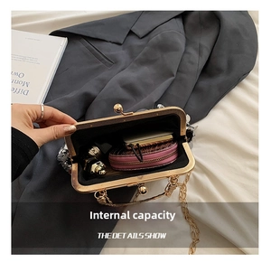 Silver sequin shell bag interior showing storage space for lipstick and small wallet