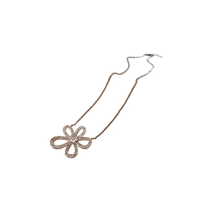 Rose gold hollow flower necklace set with cubic zirconia pave pendant on white background