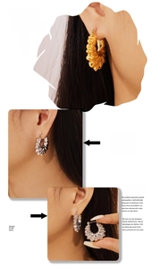 Detailed close-up showing gold and silver textured hoop earrings with a vintage finish