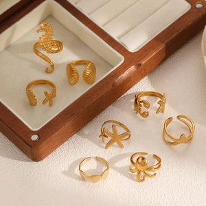 Adjustable golden stainless steel sea life rings featuring seahorse and shell designs