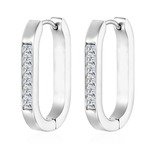 Close-up of silver U-shaped hoop earrings with channel-set square cubic zirconia