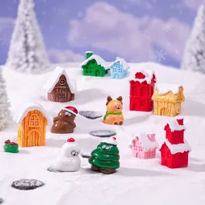 Miniature Christmas snow village set with colorful resin houses, snowmen and reindeer