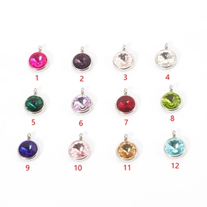 Detailed view showing twelve multi-colored crystal birthstone pendants for DIY jewelry making