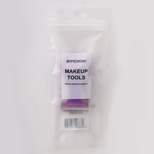 Detail of purple foldable shaver in retail packaging with barcode and brand label