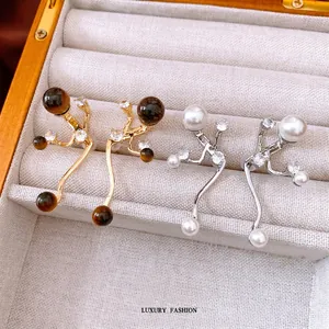 Vintage irregular gold tiger eye stone drop earrings with sparkling cubic zirconia accents