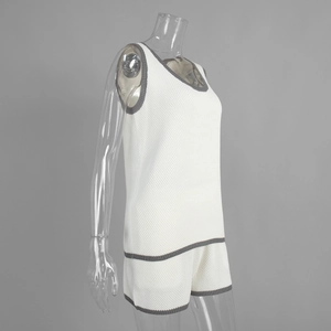 Detail of the waffle knit texture on this cream two-piece U-neck tank top and shorts set