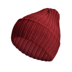 Detailed macro view of the wine red ribbed knit pattern on the winter beanie hat