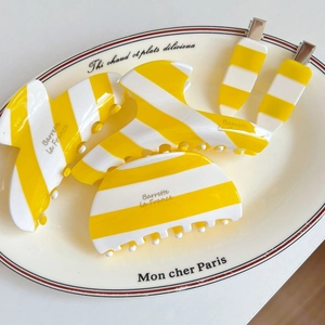 French vintage yellow striped acetate hair claw clip and barrette set in ceramic tray