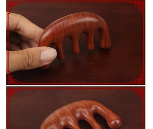 Close-up of red sandalwood massage comb showing five smooth teeth and natural wood grain