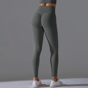 Detail of grey seamless high waist yoga pants showing peach butt scrunch and knit texture