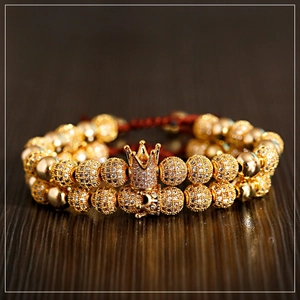 Luxury gold double-layer bracelet with sparkling crown charms and red braided cord
