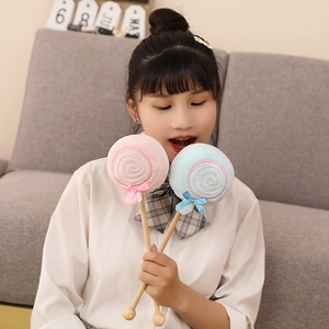 Lollipop-shaped plush massage sticks with wooden handles and decorative bows