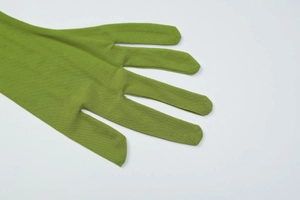 Detail view of green stretch spandex chroma key gloves for photo video background masking