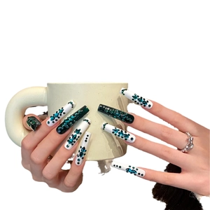 Handmade extra long emerald green and white press-on nails with luxury rhinestone art