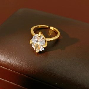 Macro view of oval cubic zirconia stone on an 18k gold-plated open adjustable ring