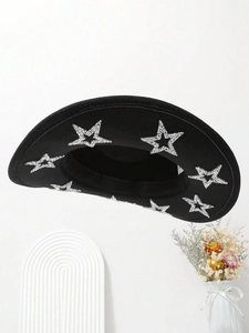 Detailed top view of black felt cowboy hat featuring shiny silver sequin star accents
