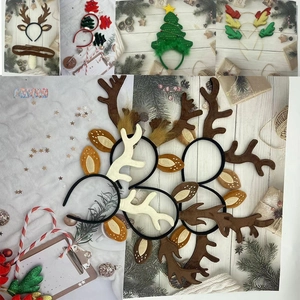 Close-up of festive Christmas antler headbands with plush textures and star details