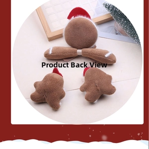 Detailed back view of plush gingerbread man Christmas hair accessories with sewing details