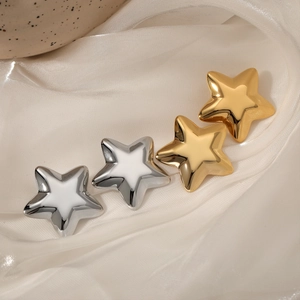Polished stainless steel star stud earrings in gold and silver with white enamel inlay