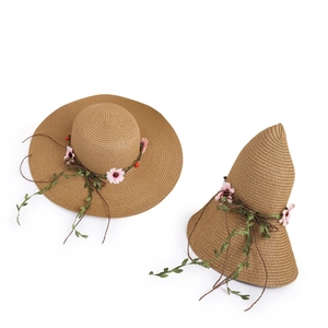 Women's wide brim woven straw sun hat with pink flowers and green leaf decoration