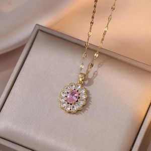 Pink oval gemstone pendant necklace with white zircon petals on champagne silk
