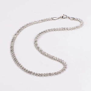 Detailed macro view of sparkling silver stainless steel textured necklace links