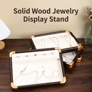 Walnut wood jewelry display trays with gold metal corners and velvet lining for rings