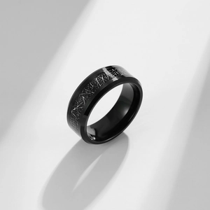 Detail of black tungsten ring featuring silver textured inlay and polished finish