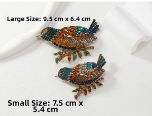 Size comparison detail showing the dimensions of the vintage crystal magpie brooches