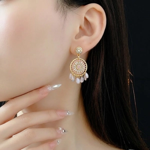 Bohemian geometric pearl tassel earrings with pink bead patterns and crystal drops