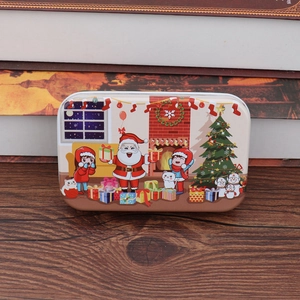 Christmas tin box with Santa Claus puzzle, wooden surface with warm holiday atmosphere