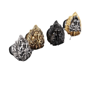 Men's stainless steel lion head rings in gold, silver, and black finishes on white background
