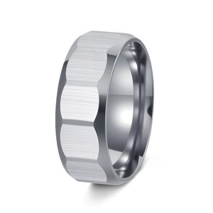 Macro view showing the brushed metal center and faceted edges of the titanium steel ring