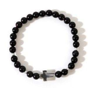 Gothic matte black agate beaded bracelet with silver cross pendant on white background