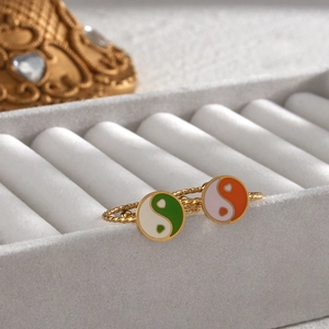 Detail of 18K gold plated adjustable rings with colorful Tai Chi Yin Yang enamel patterns