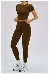 Close-up of olive green tight yoga top with high-waist fitness leggings set for women