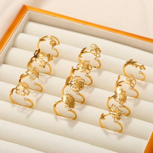 Set of 12 gold-plated stainless steel birth flower rings with white zircon accents