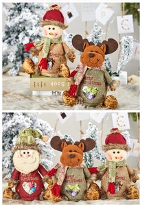 Detail of Christmas burlap gift bags with Santa, reindeer and snowman heart window